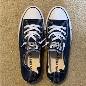 Woman’s navy blue converse